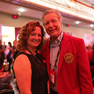 A photo of Natalie Lorenz Anderson and Bruce Anderson inside a theater