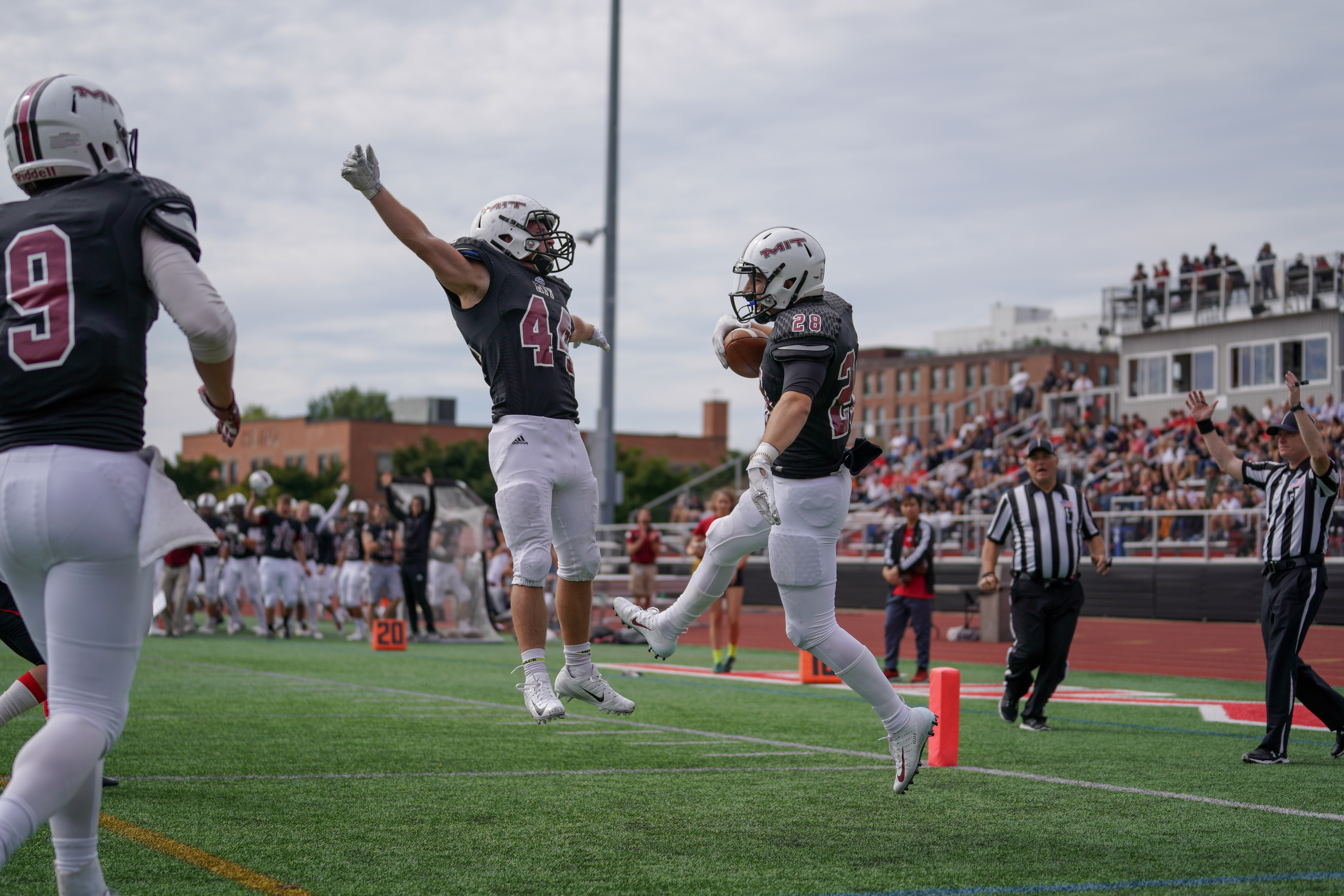 Football players celebrating mid-air