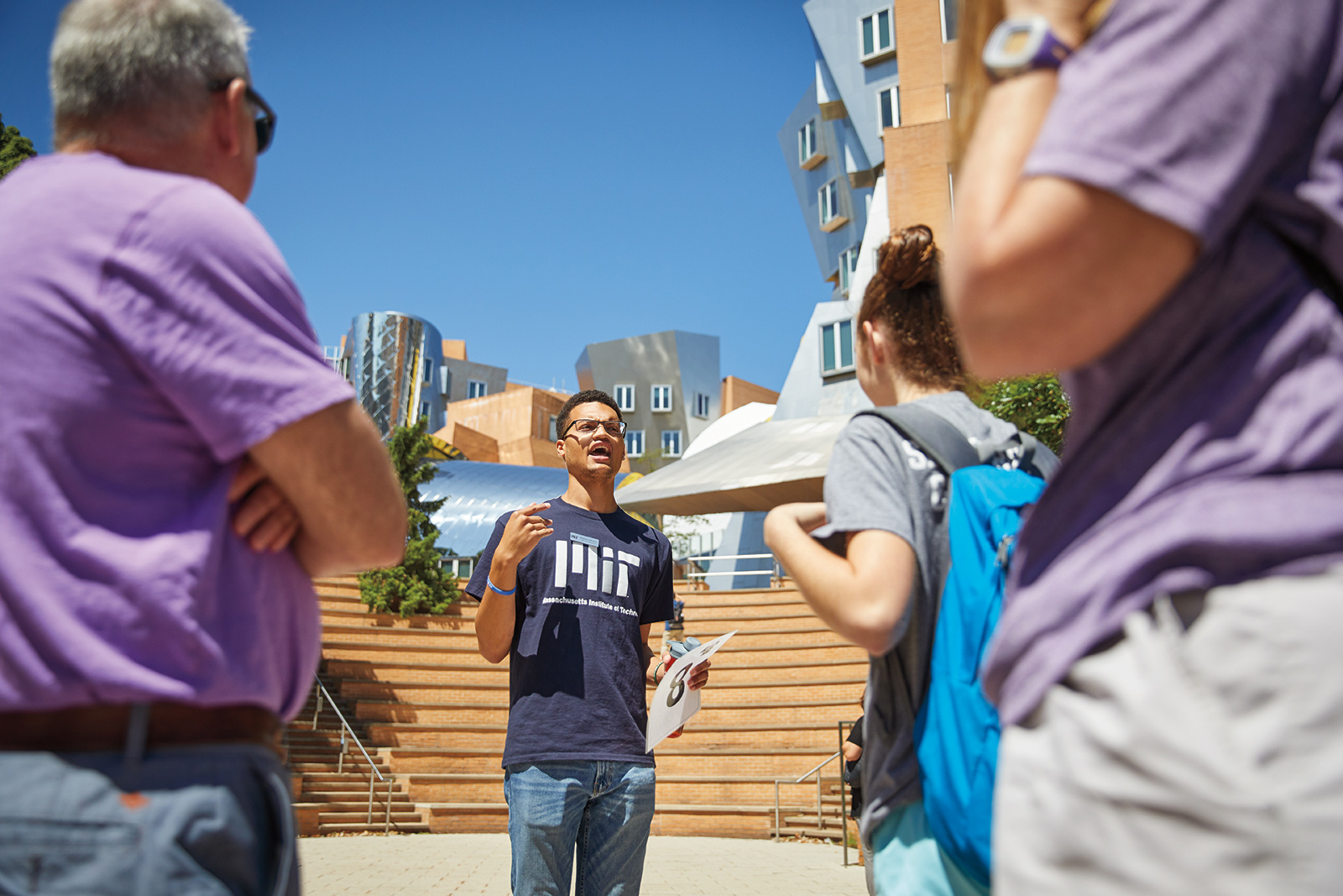 An MIT student speaks to a group on campus