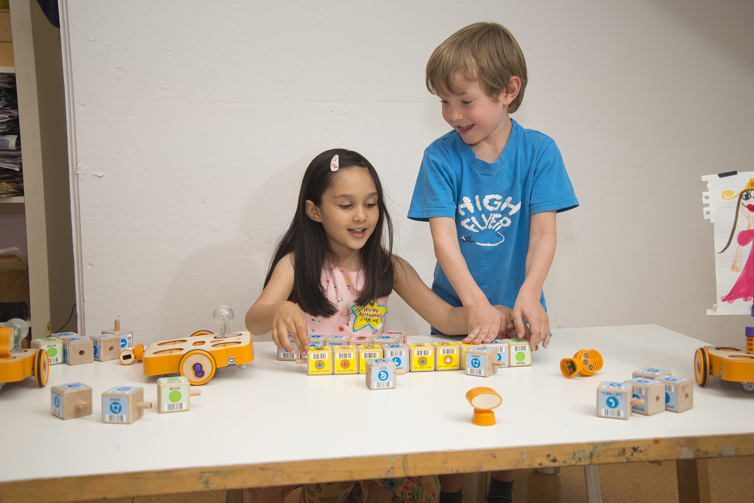 Kids play with the Kinderlabs KIBO robot