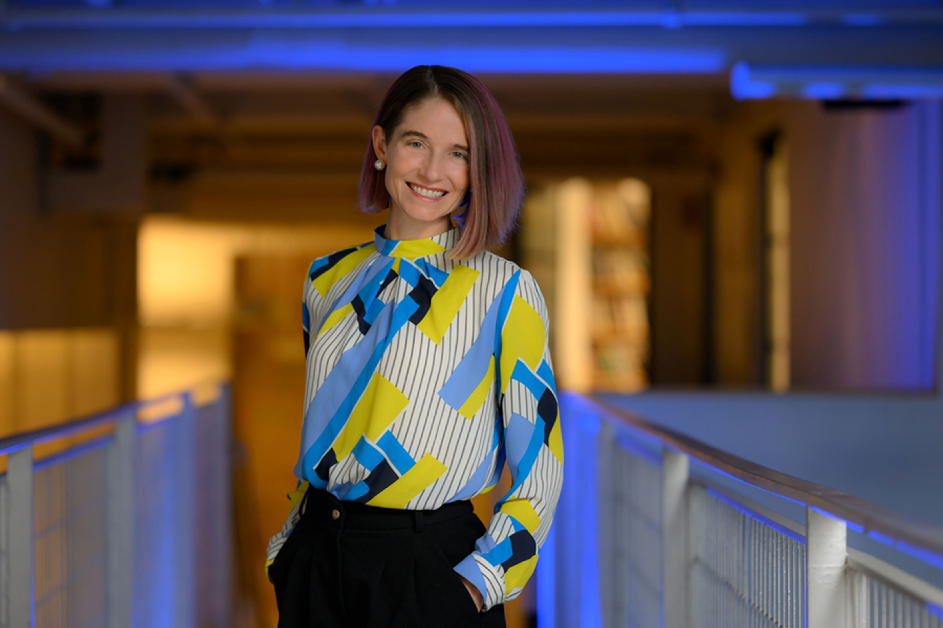 Catherine D’Ignazio portrait with blue lighting.