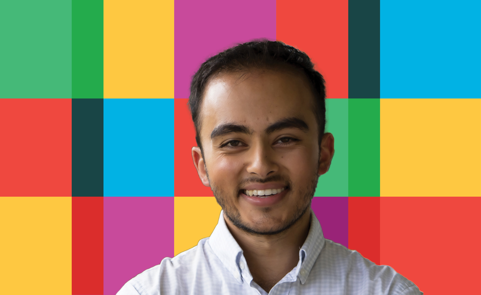 A photo of Yusuf Ahmad on a background of a primary color grid