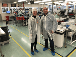 two people in protective lab wear